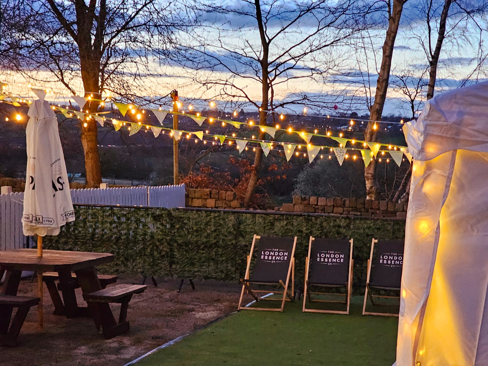Folding chairs and fairy lights at the Crown and Anchor pub garden
